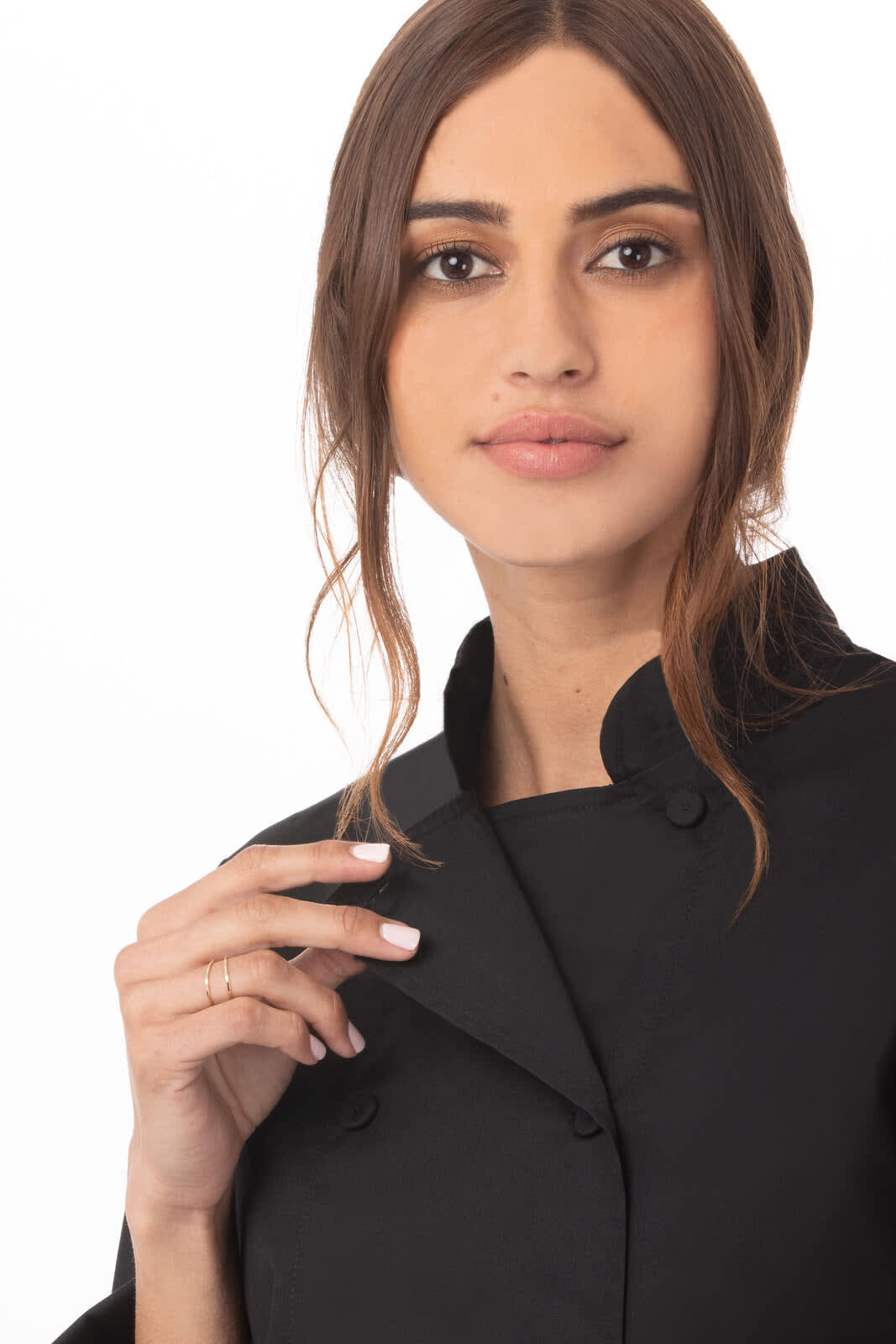 A women's black chef jacket, featuring a collar and professional button closure, worn by a model with long hair.