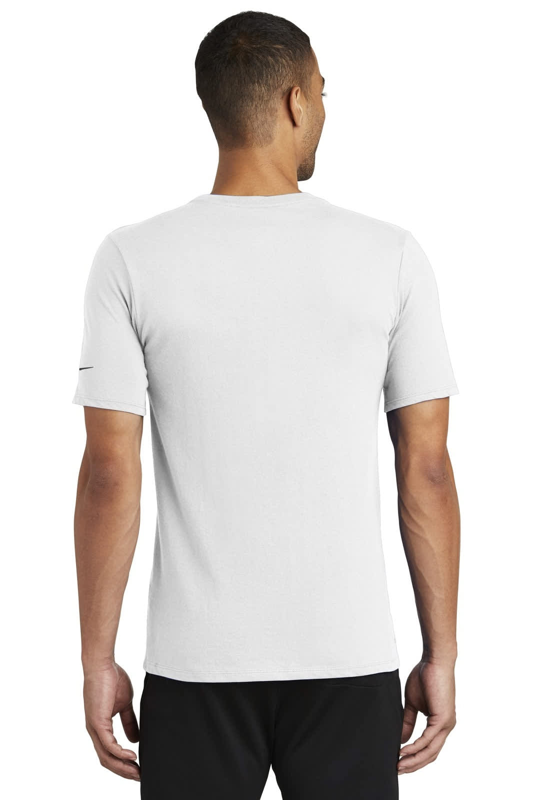 A man is seen from the back wearing a grey Nike Dri-FIT cotton/polyester T-shirt. It features a logo on the sleeve.