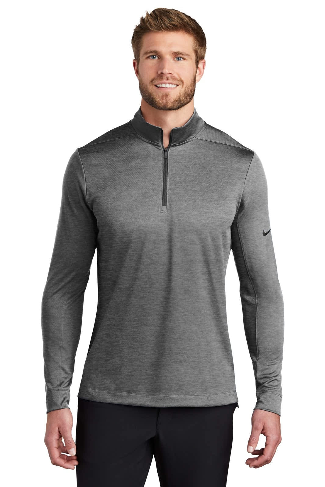 A grey Nike Dry 1/2-Zip Cover-Up with long sleeves and a zippered collar, featuring a logo on the sleeve.