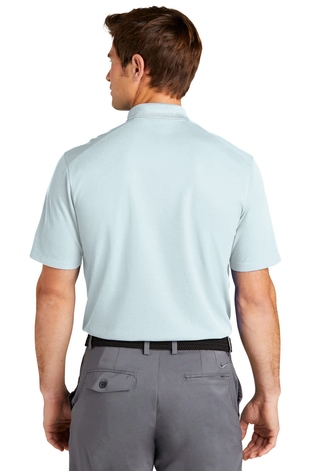 A light blue Nike Dri-FIT Micro Pique 2.0 polo shirt is displayed, featuring short sleeves and a collar.