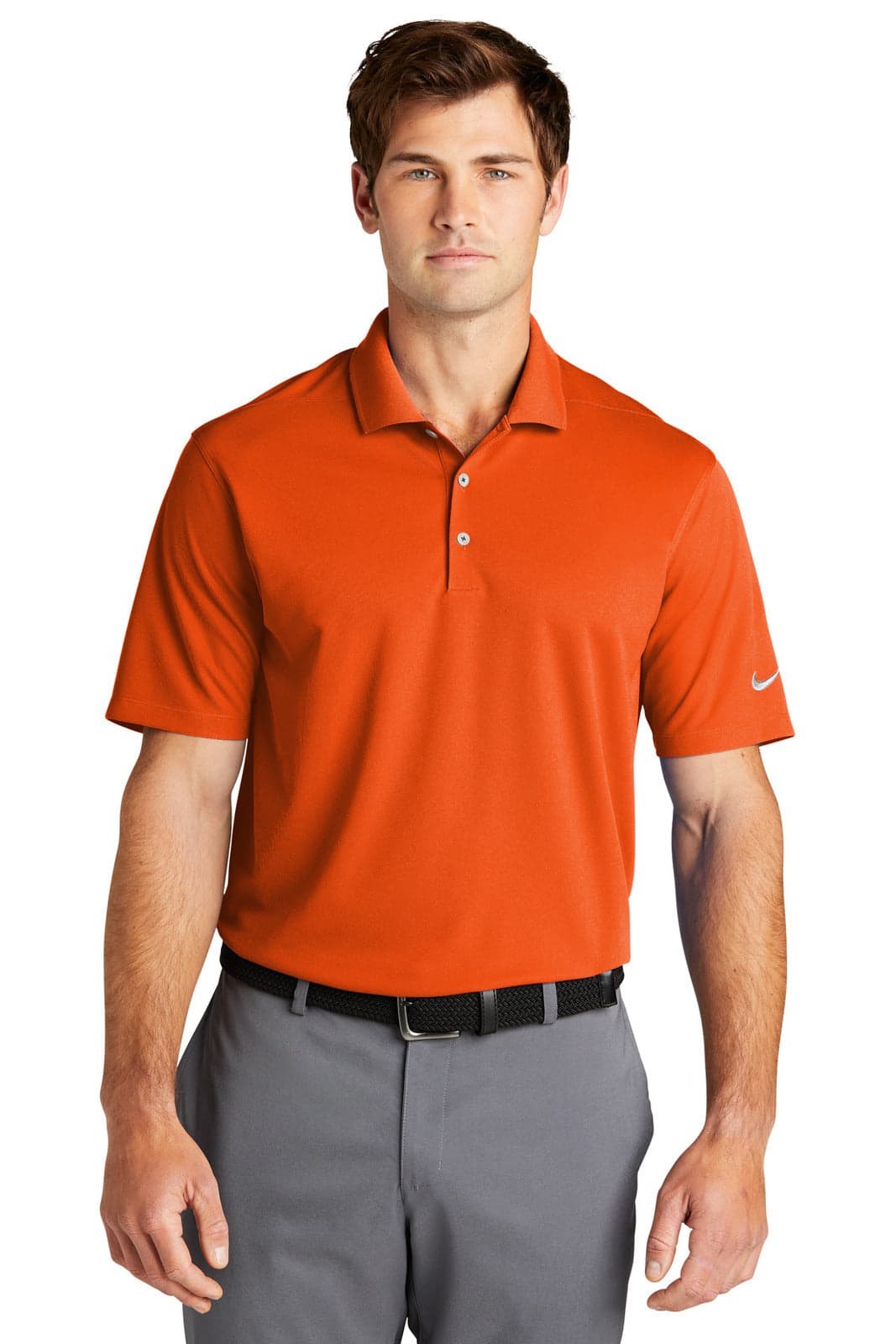 An orange polo shirt with short sleeves and a collar, featuring a logo on the sleeve.