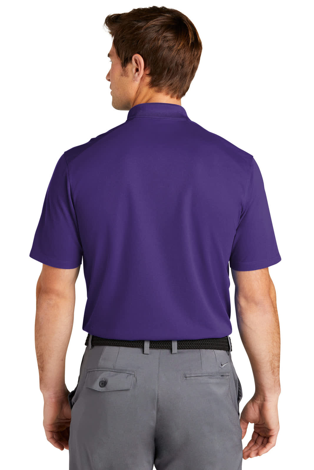 A back view of a man wearing a purple Nike Dri-FIT Micro Pique 2.0 Polo shirt with a logo.