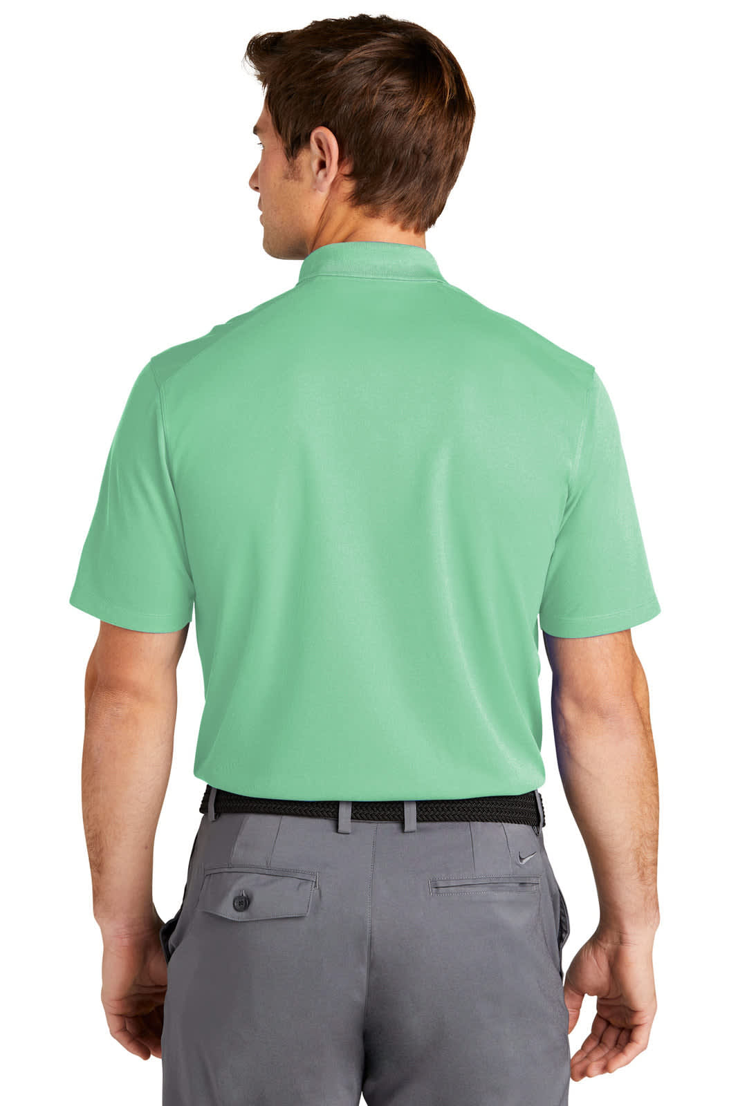 A man in a mint green polo shirt, featuring a collar and short sleeves, viewed from the back. The shirt has a logo.