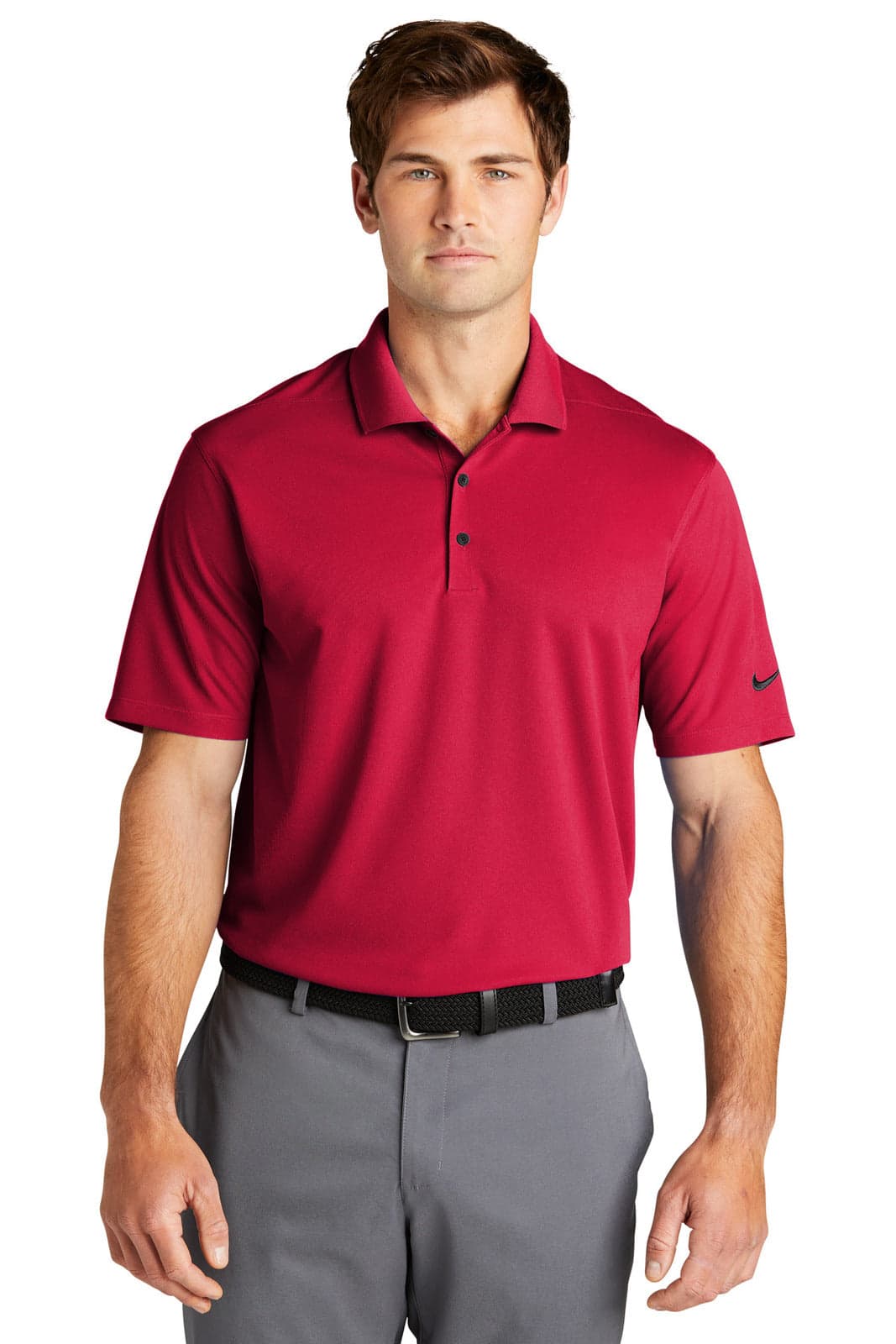 A red Nike Dri-FIT Micro Pique 2.0 polo shirt with a logo, paired with grey trousers.