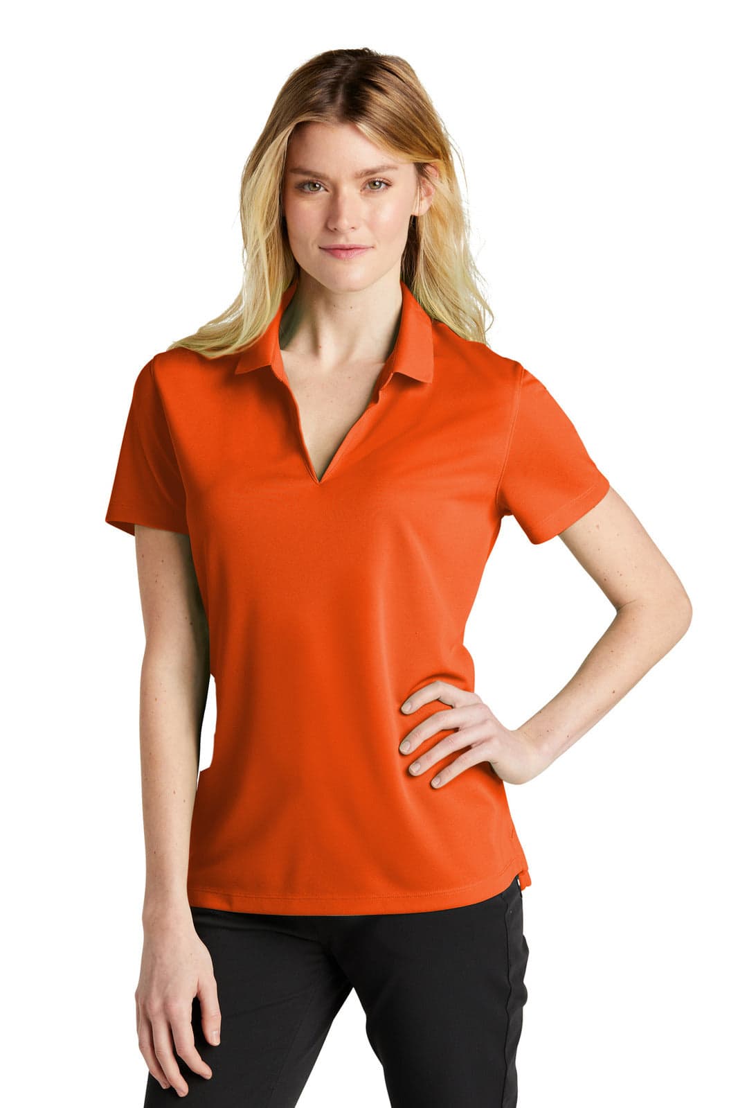 An orange Nike Dri-FIT micro pique polo shirt for ladies, featuring a collar and short sleeves.
