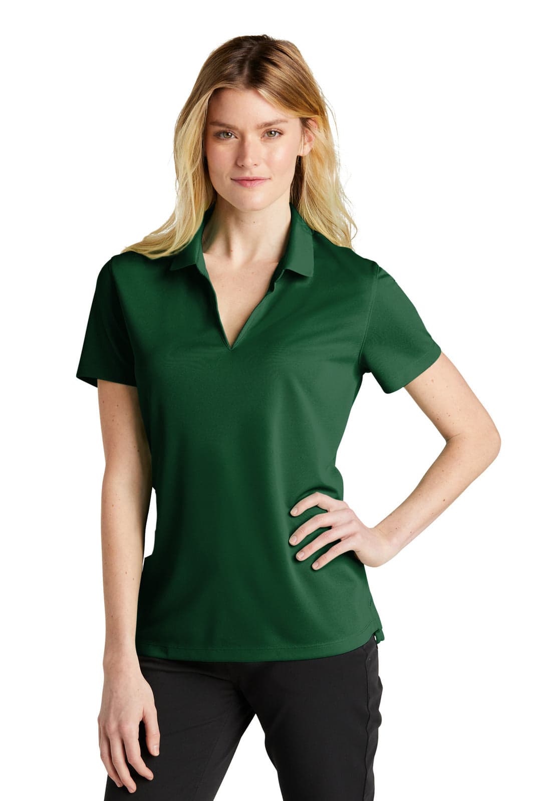 A green polo shirt in a fitted style, displayed by a model. The shirt features a collar and has a logo.