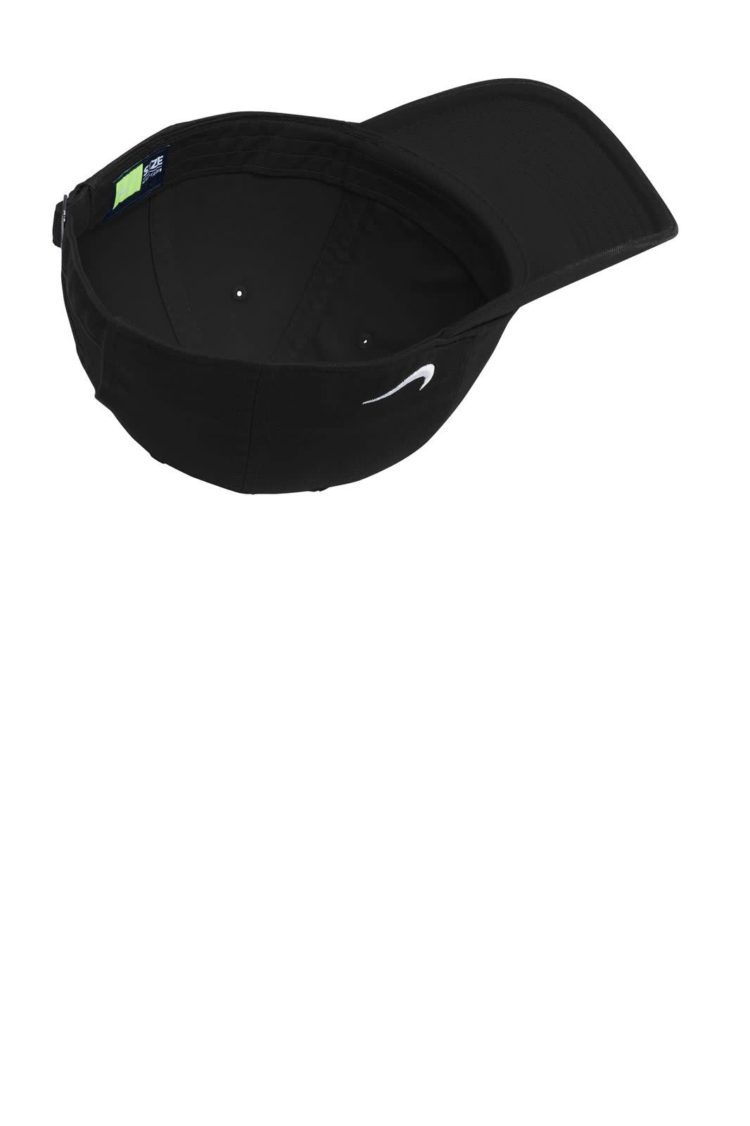 A black Nike Heritage 86 cap featuring a curved brim and an inner lining. The cap has a logo on the front.