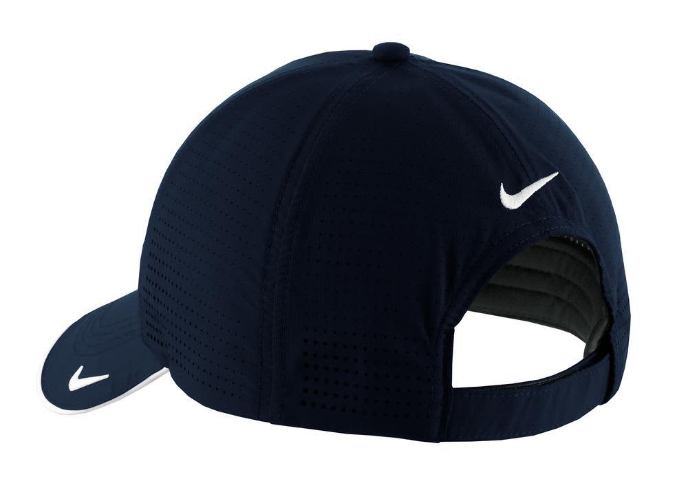 A navy blue cap with a perforated design and a logo on the side. Features a curved brim and adjustable back.