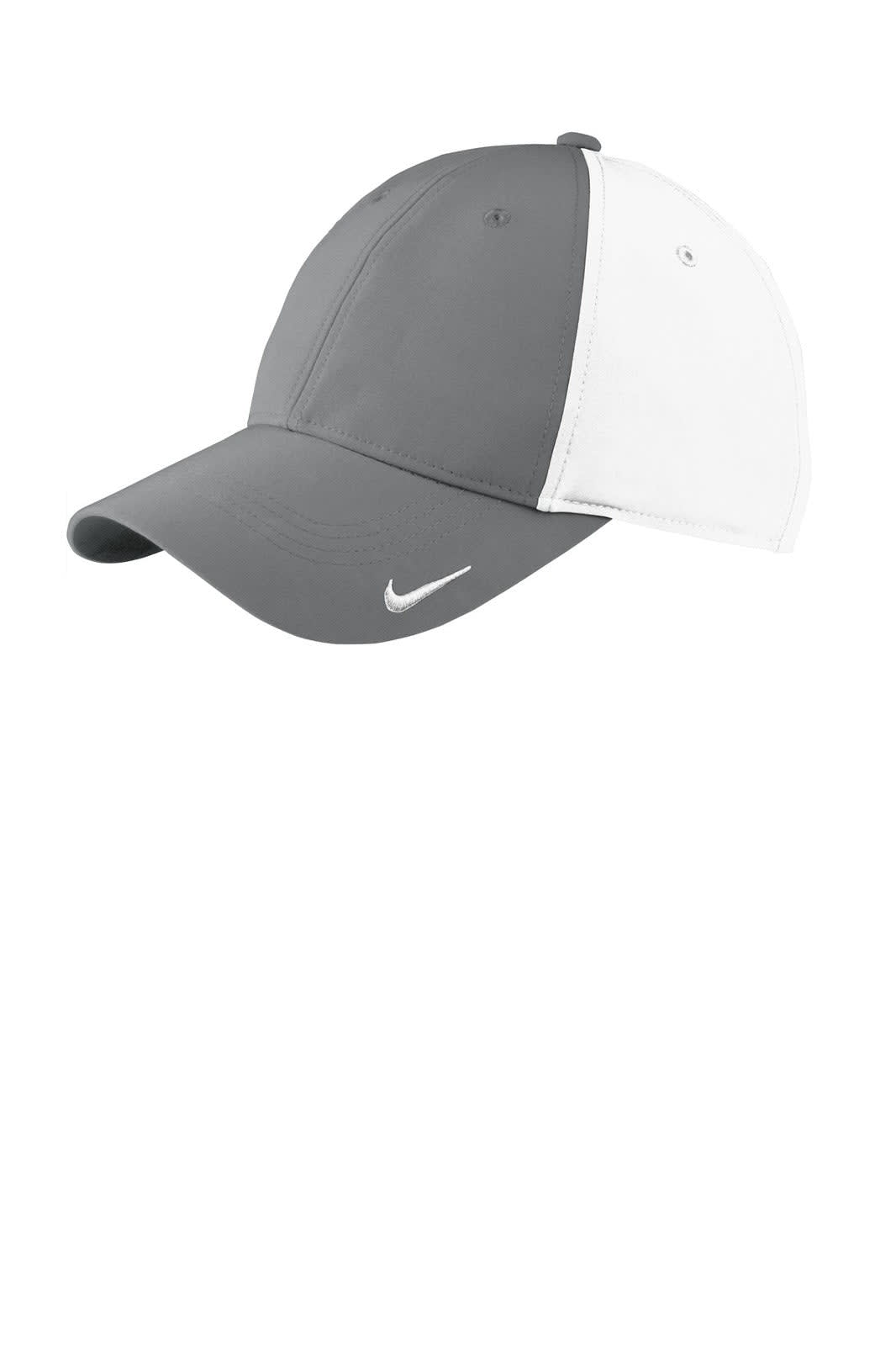 A grey and white Nike cap featuring a curved brim and a logo on the side.