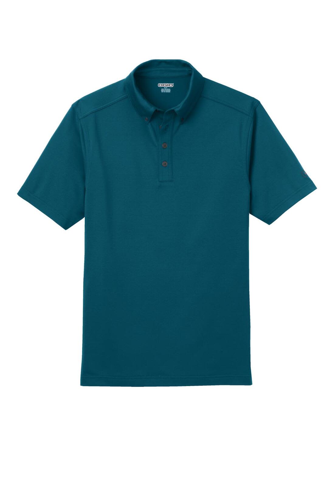 A teal OGIO Gauge Polo shirt with a buttoned neck and short sleeves. It features a logo on one side.