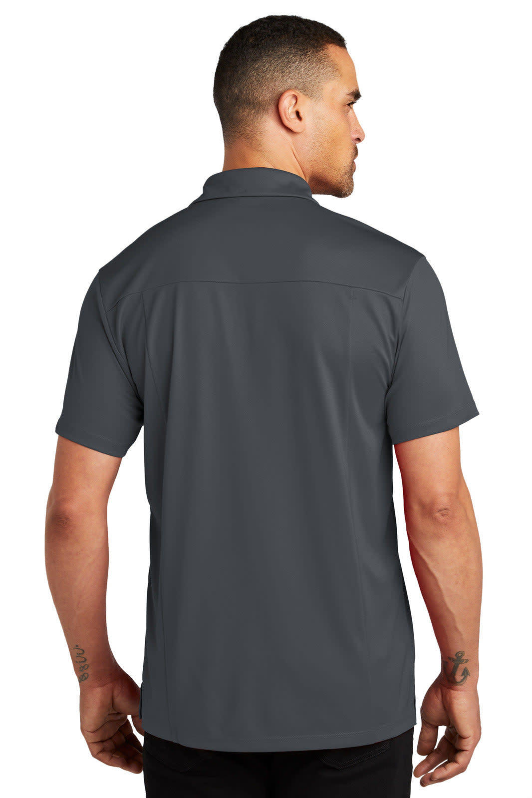 A grey polo shirt featuring a classic design, displayed on a person from the back, with a logo on the collar.