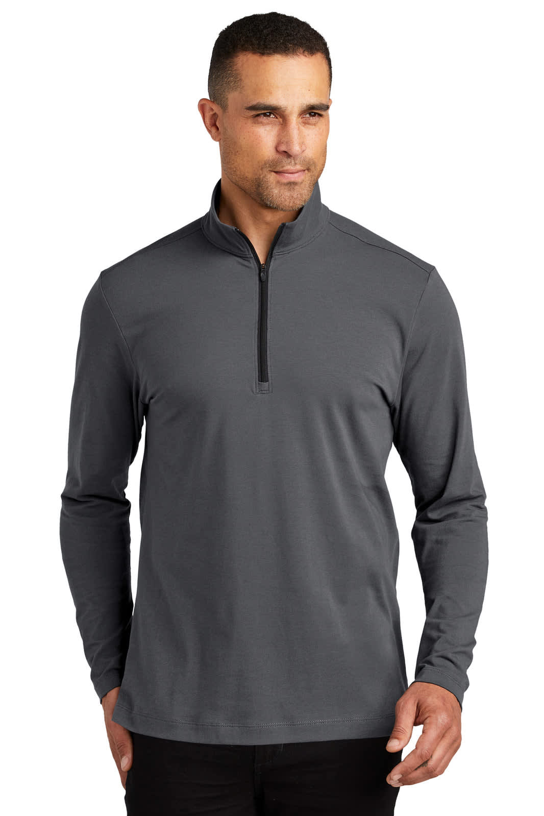 A grey 1/4-zip jumper modelled by a man with long sleeves and a sleek design. It features a logo.
