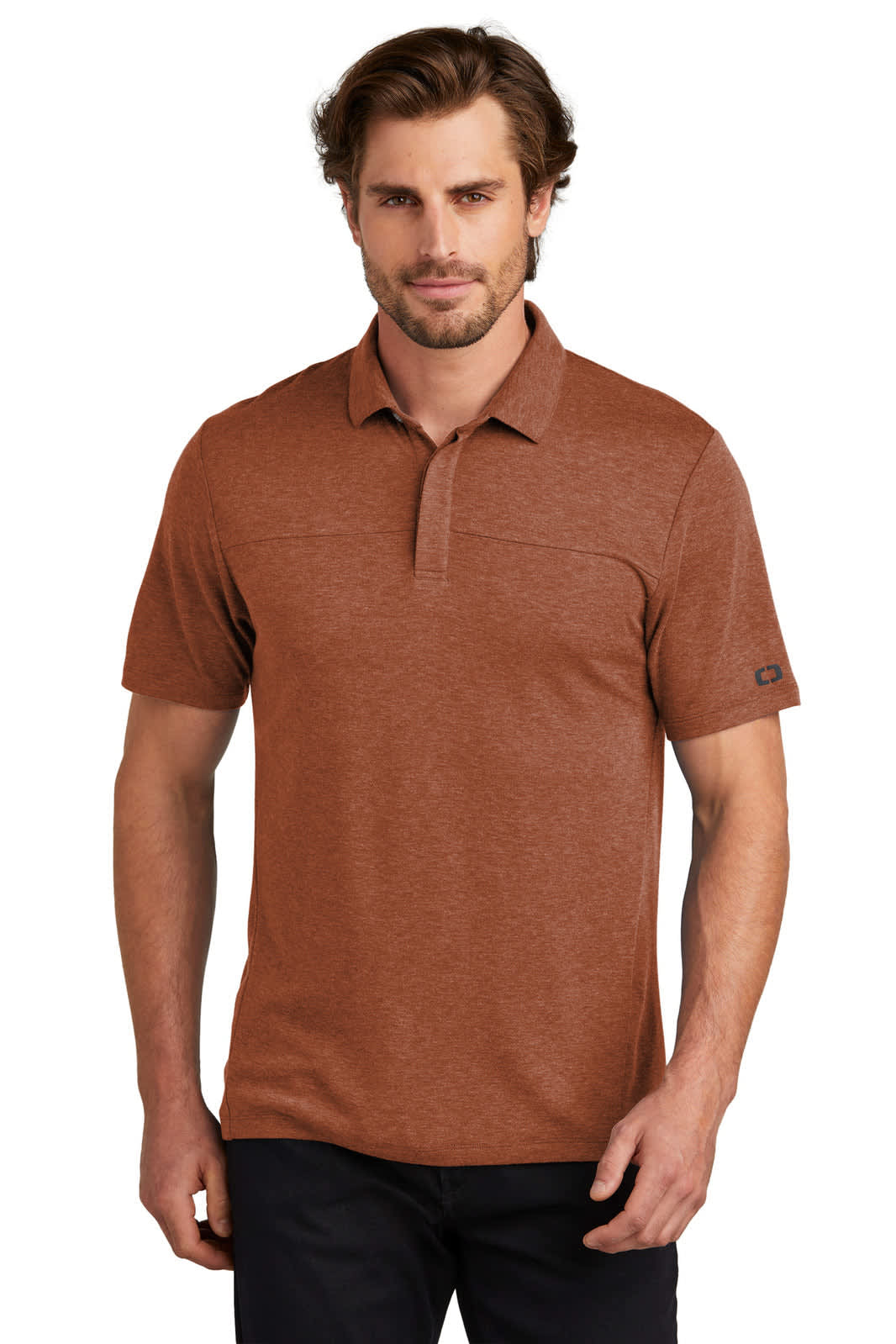 A short-sleeved polo shirt in a rust colour with a subtle texture and a logo on the sleeve.