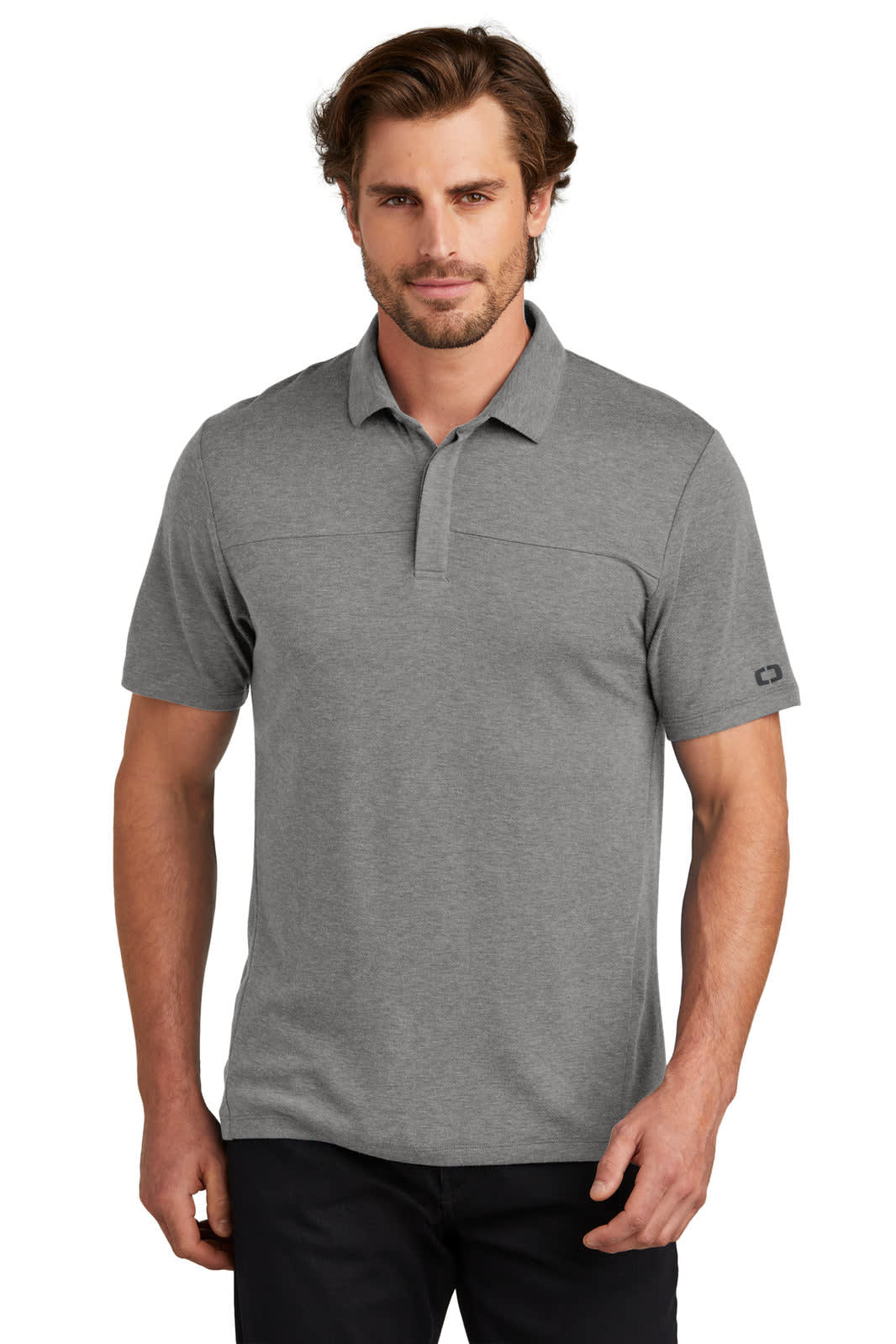 A man wearing a grey OGIO Command Polo shirt with short sleeves and a subtle logo on the sleeve.