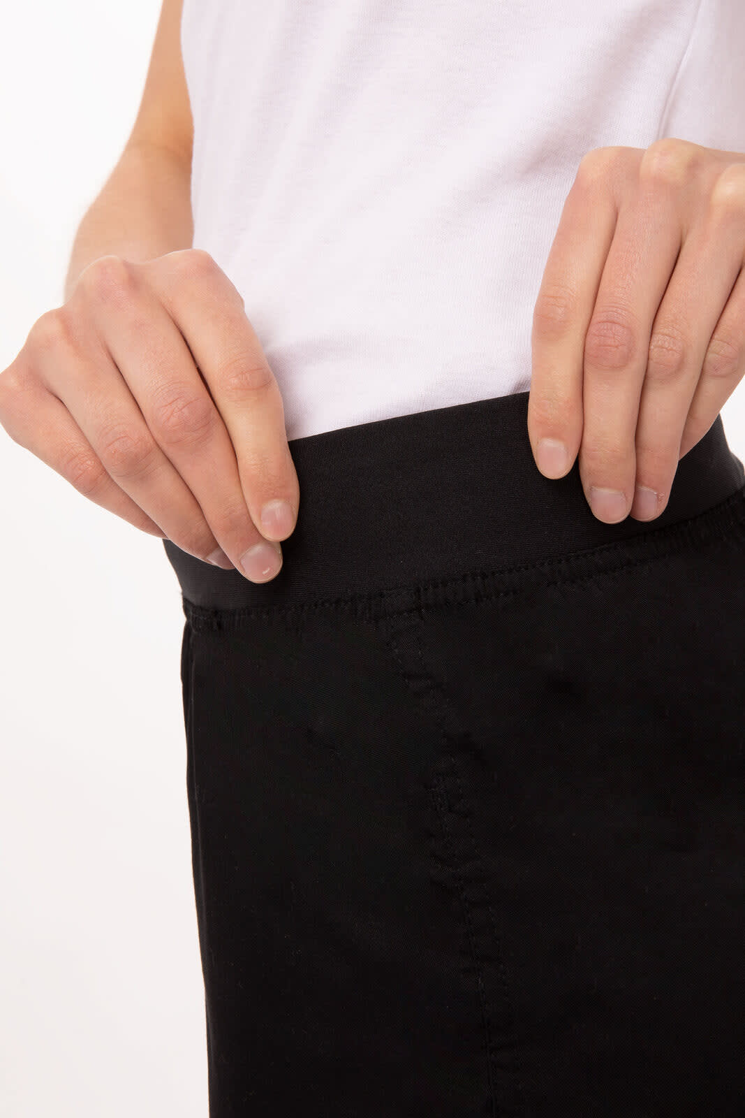 Lightweight slim women's chef pants in black, featuring a smooth waistband and detailed stitching.