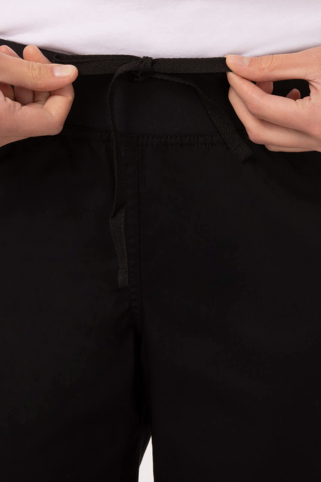 A pair of lightweight slim women's chef pants in black, featuring an elastic waistband with a drawstring.