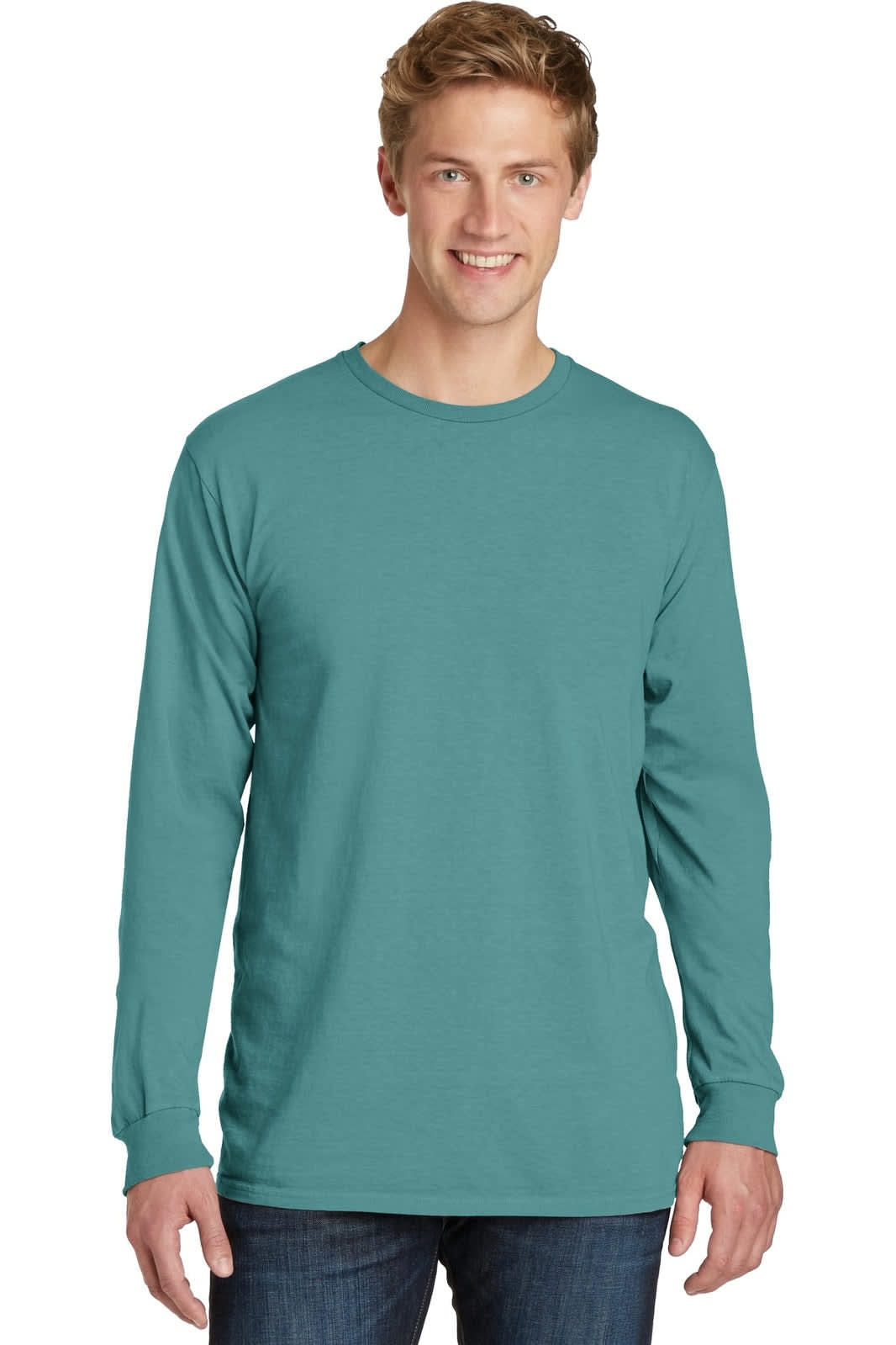 A long sleeve tee in teal, featuring a logo, styled on a model with light jeans.