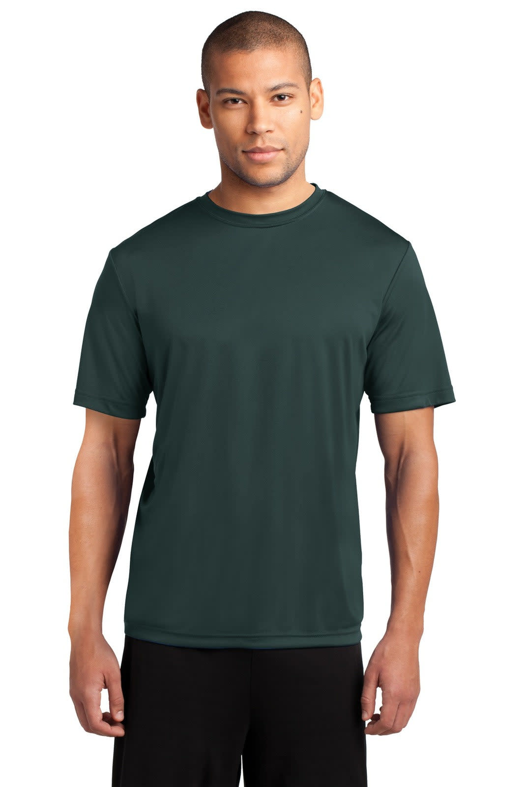 A green performance tee is displayed on a model, featuring a simple design and short sleeves. The shirt has a logo.