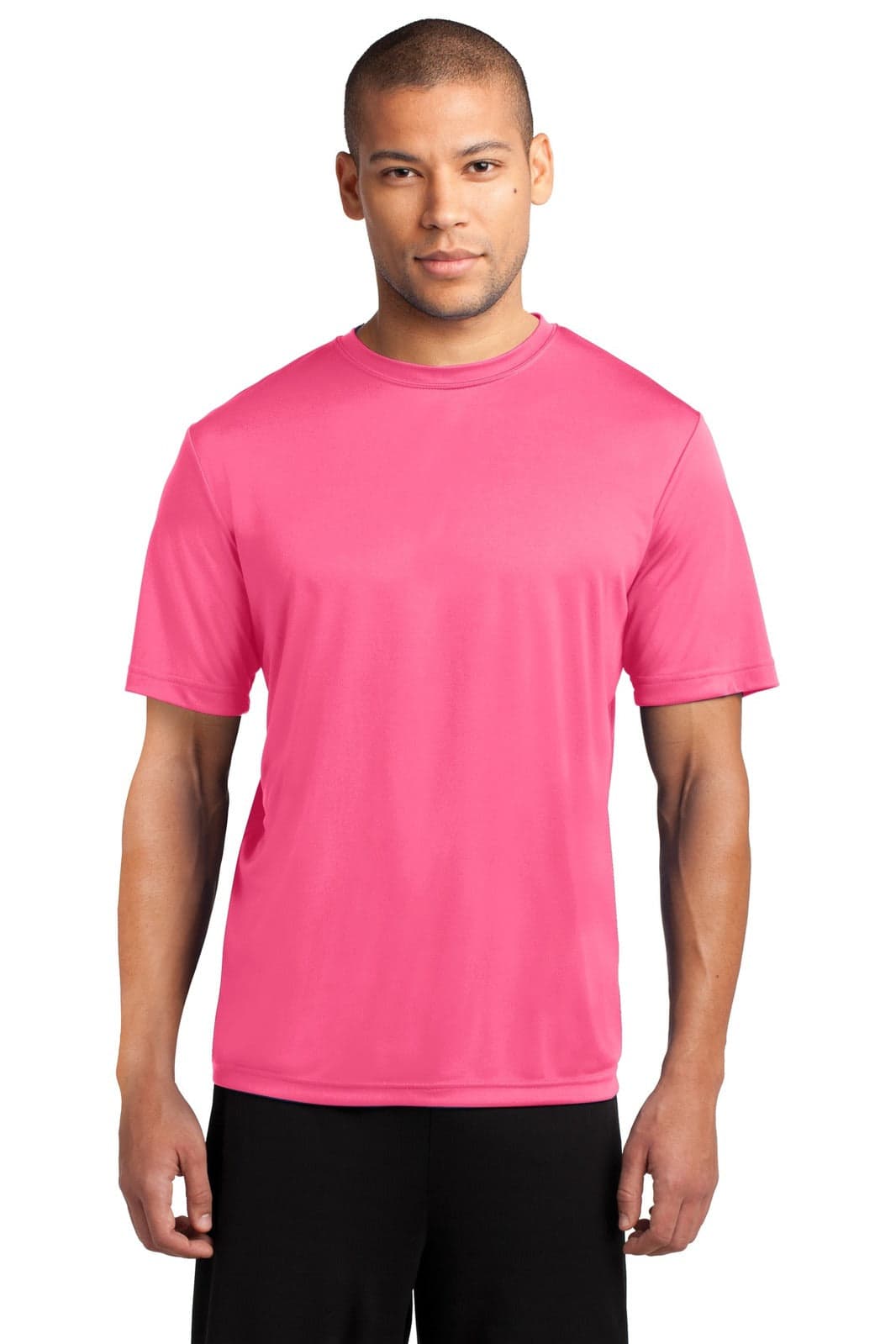 A man is wearing a vibrant pink Performance Tee, featuring short sleeves and a logo on the chest.