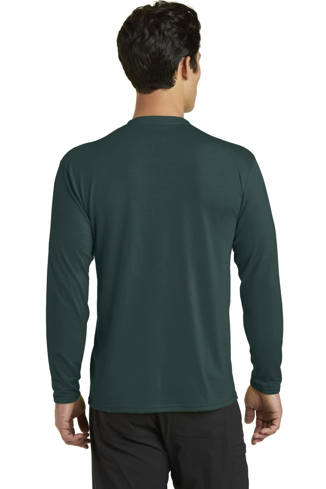 A man wearing a long sleeve performance blend tee in dark green, viewed from the back, with a logo present.