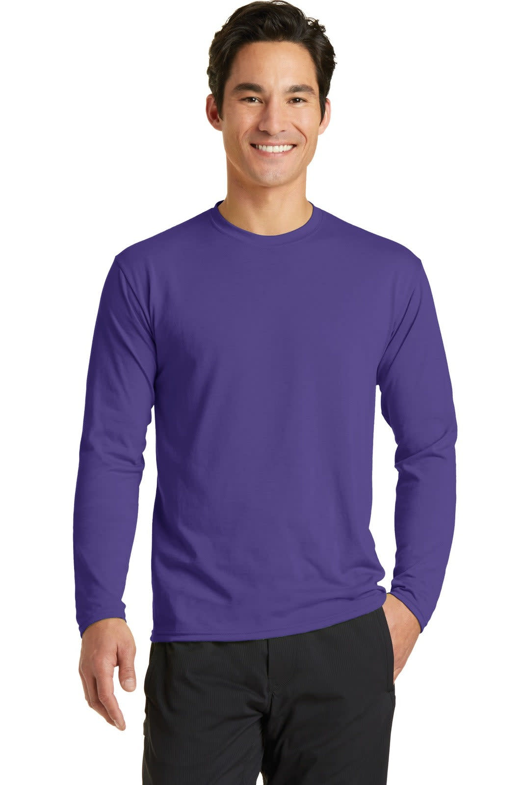 A man wearing a long sleeve performance blend tee in purple. The shirt has a logo on it.