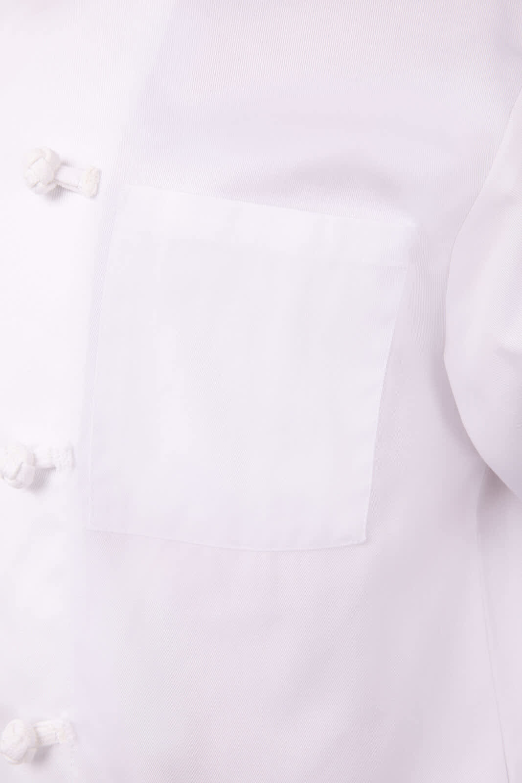 A white chef jacket featuring a front pocket and traditional button closure. It has a logo on the chest area.