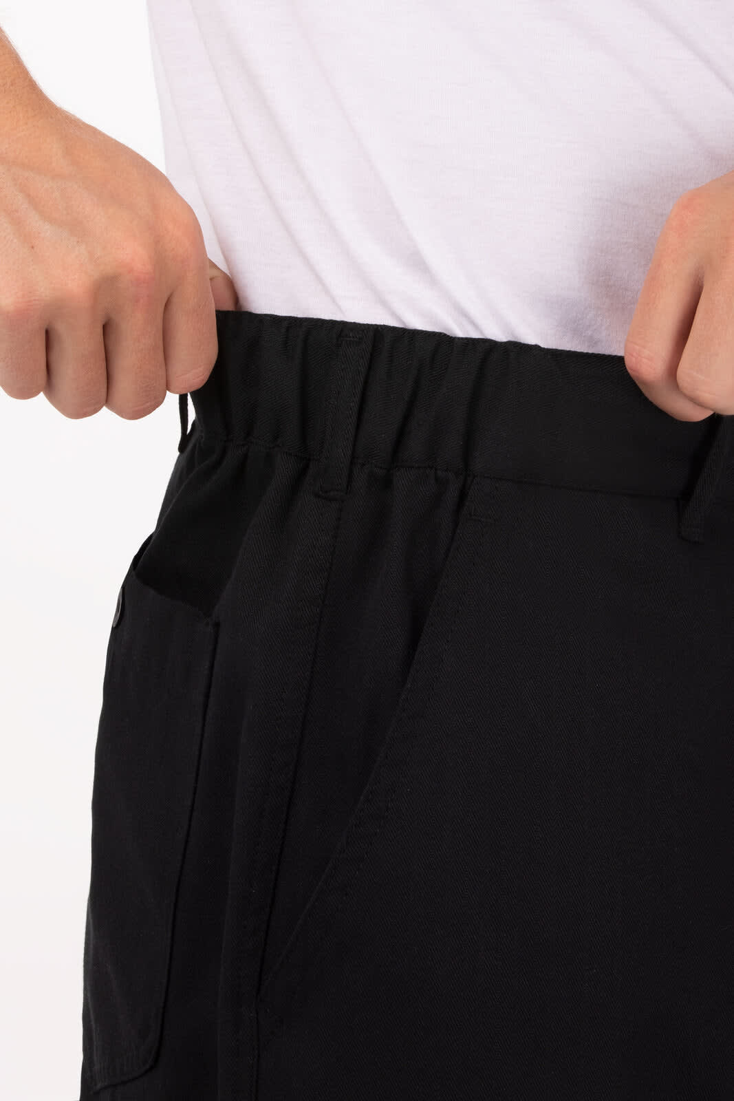 Black men's chef pants with elastic waistband and side pockets, featuring a person adjusting the waistband.