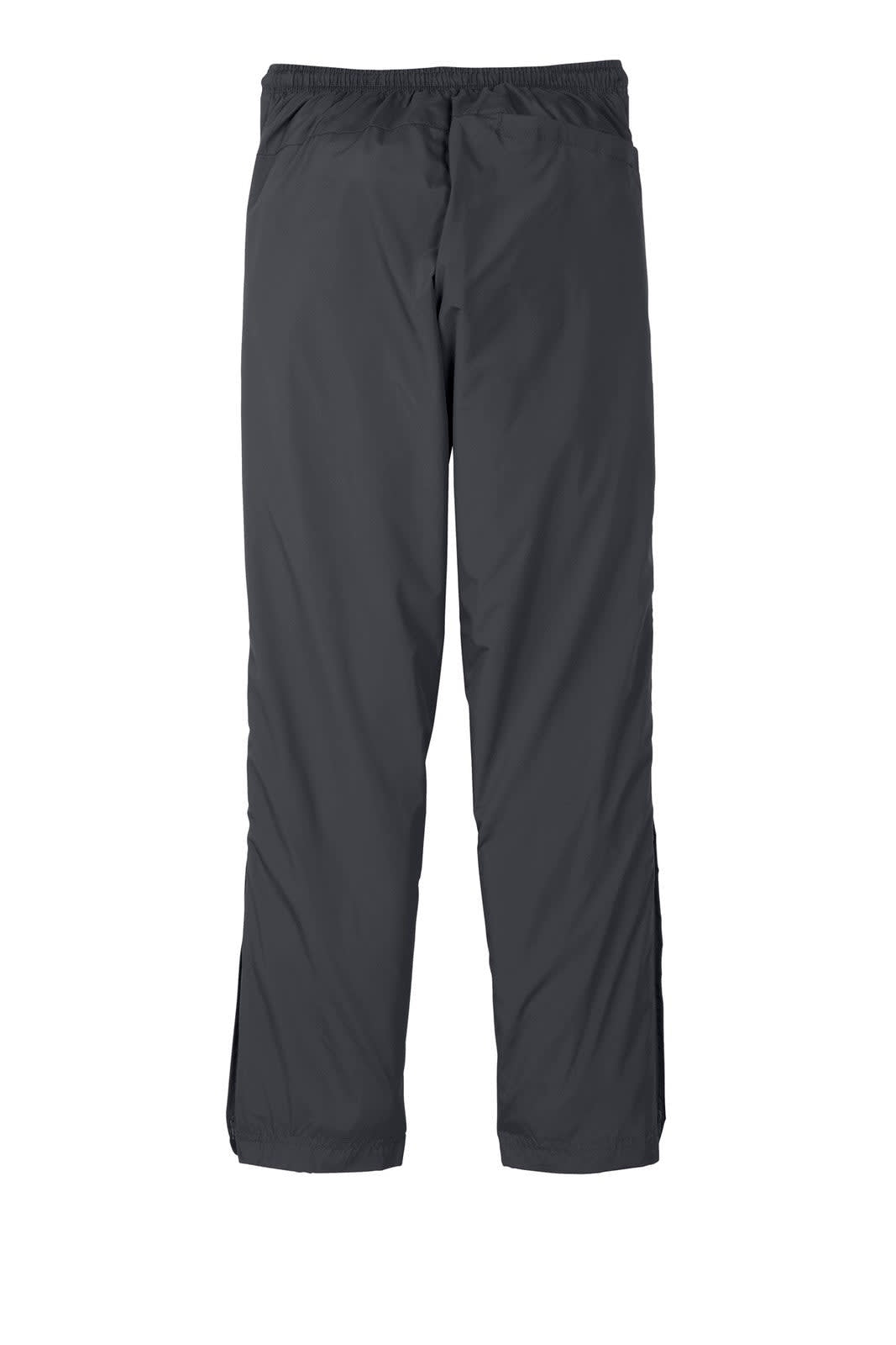 Wind pants in dark grey, featuring an elastic waistband and straight-leg design. Includes a logo on the fabric.