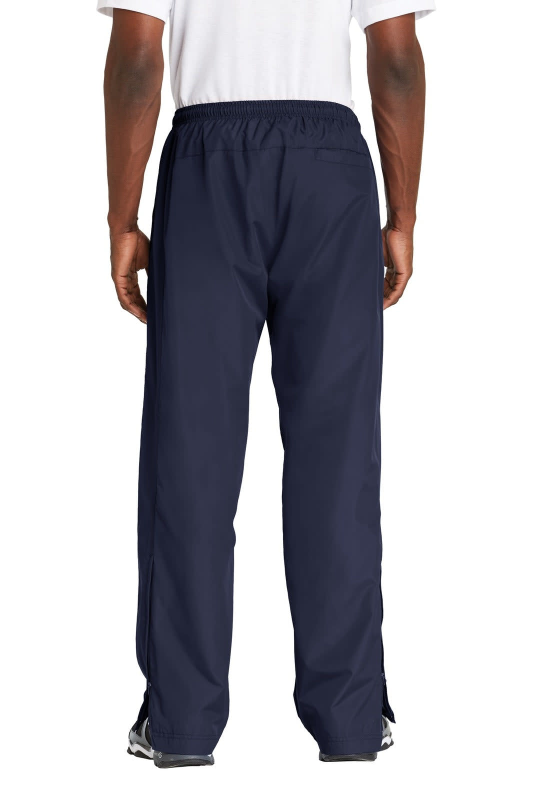 Navy track pants with an elastic waistband and a logo, shown from the back view. Suitable for active wear.