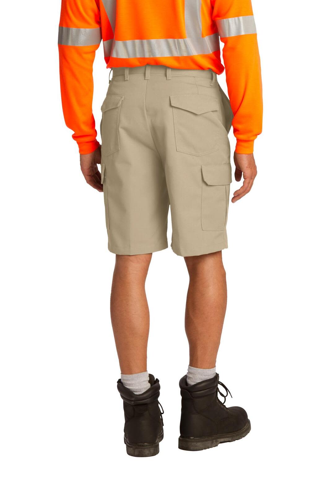 A pair of beige cargo shorts with multiple pockets, worn by a person in a high-visibility orange shirt and black boots.