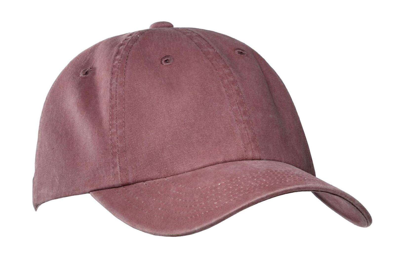 A garment-washed cap in a dusty rose colour, featuring a curved brim and ventilation holes. It has a logo on the front.