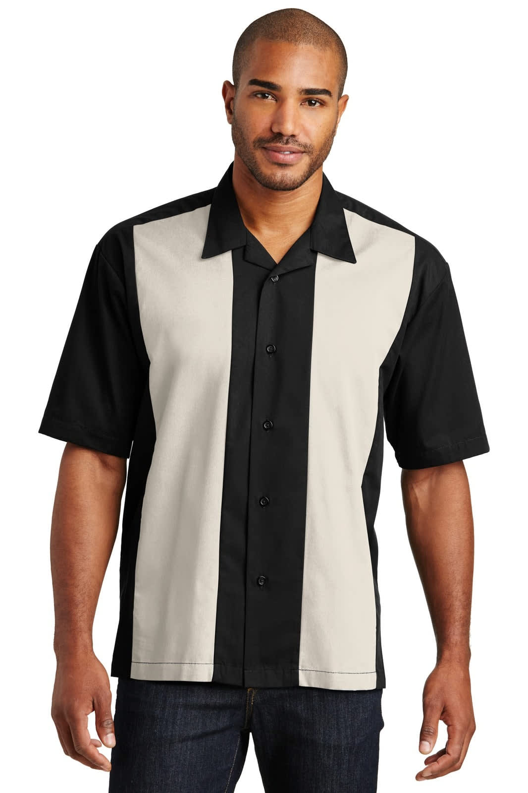 A black and beige retro camp shirt with short sleeves and a button-up front. It features a logo on one side.