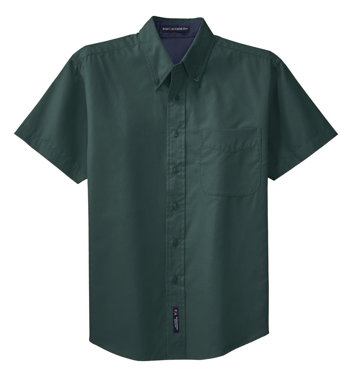 A short sleeve button-up shirt in dark green with a chest pocket and a logo.