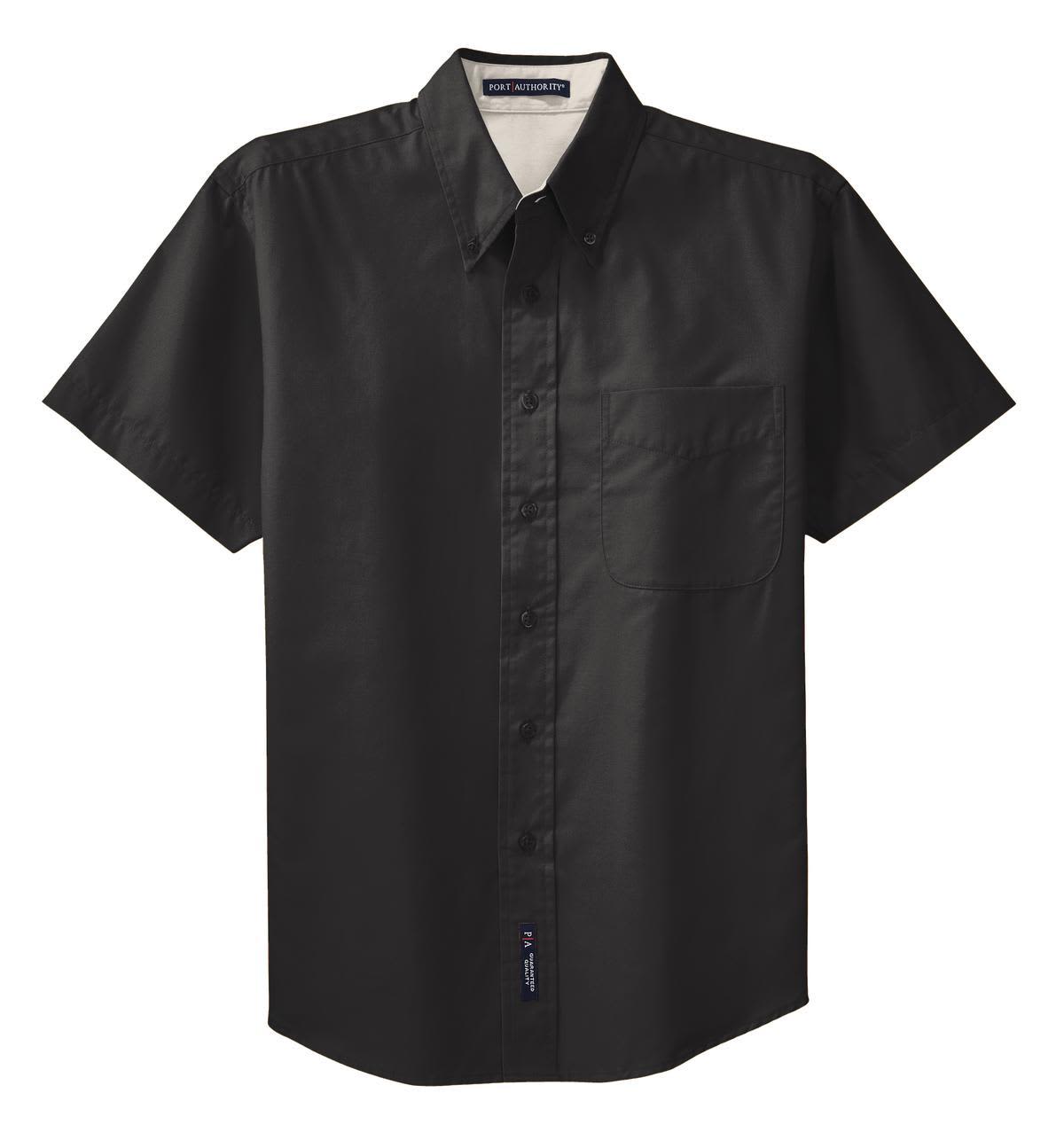 A black short sleeve button-up shirt with a chest pocket and a logo on the bottom hem.