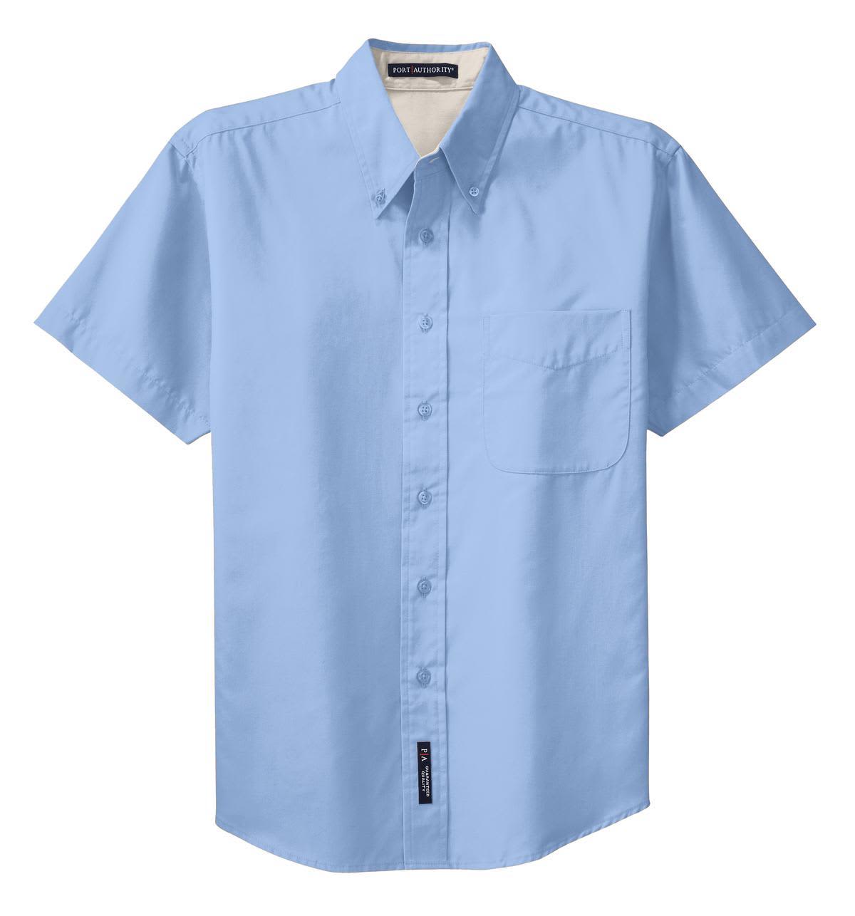 A light blue short sleeve button-up shirt featuring a chest pocket and a logo tag at the hem.