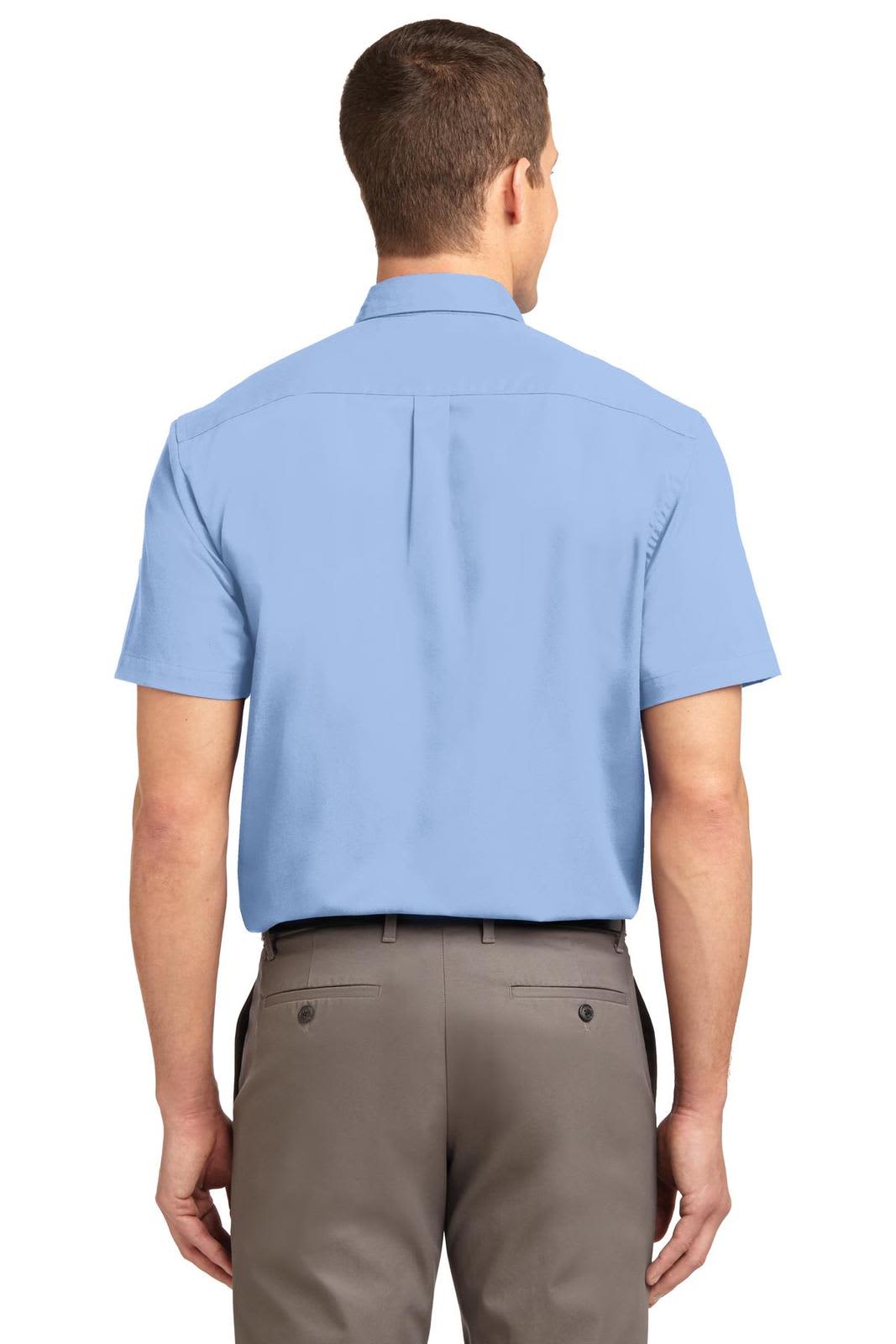 A short sleeve button-up shirt in light blue, featuring a back yoke and a logo.