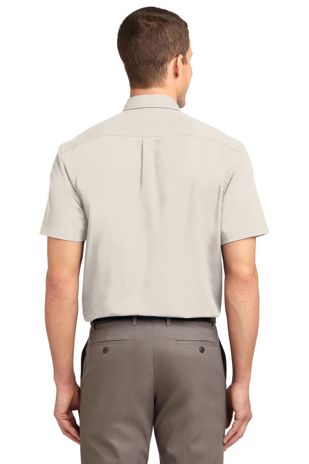 A light grey short sleeve button-up shirt from Port Authority with a back yoke and a logo at the collar.