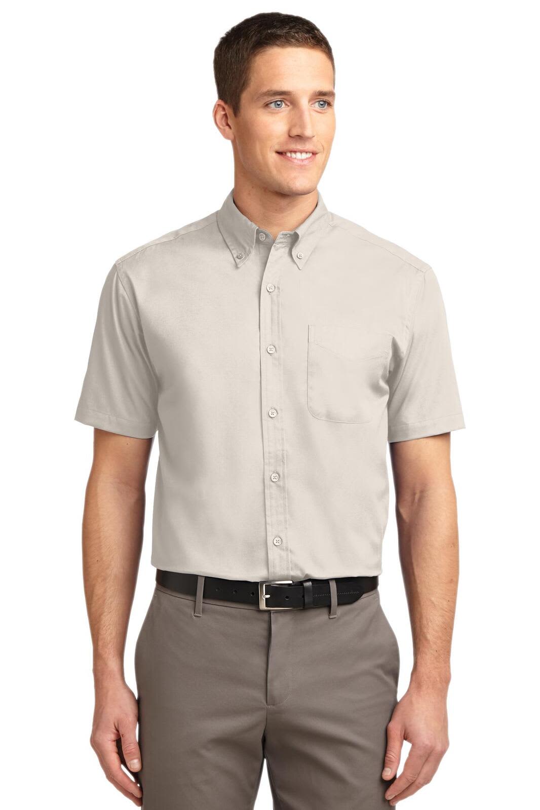 A short sleeve button-up shirt in grey, featuring a collar and a chest pocket, with a logo.