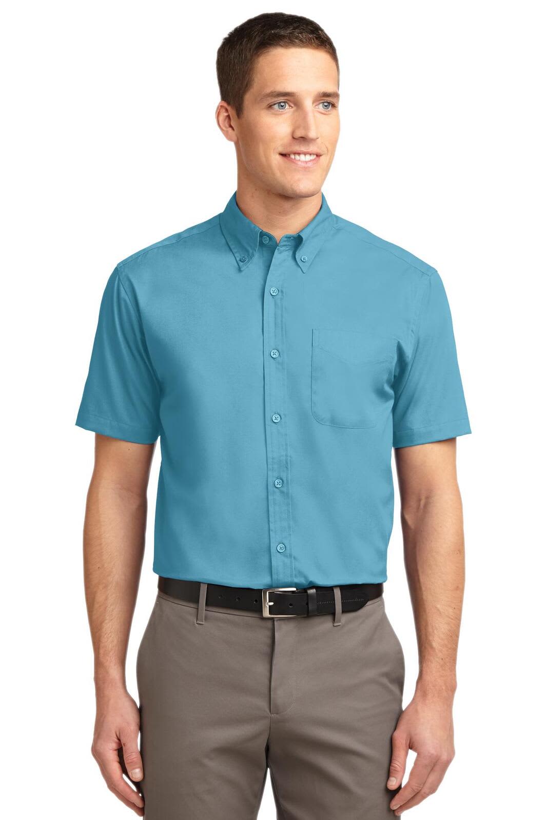 A short-sleeve button-up shirt in teal with a collar and a chest pocket, featuring a logo.