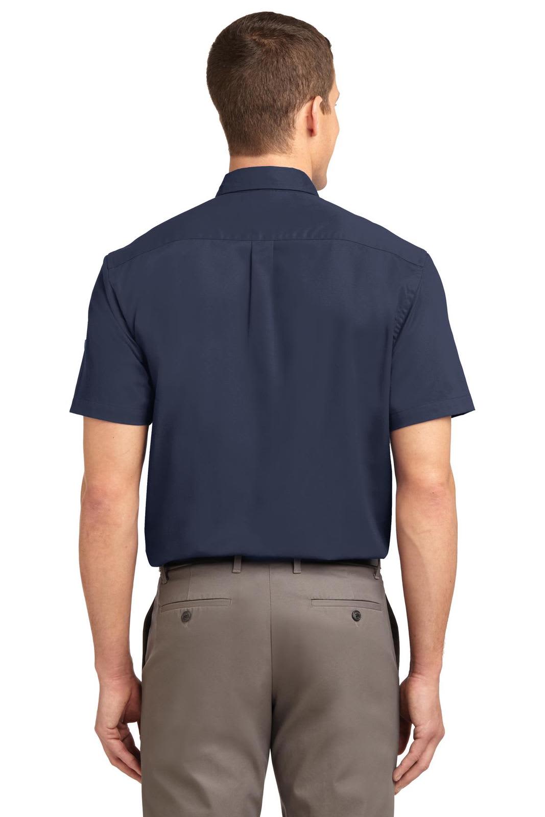 A navy short sleeve button-up shirt featuring a simple design and a logo on the back.