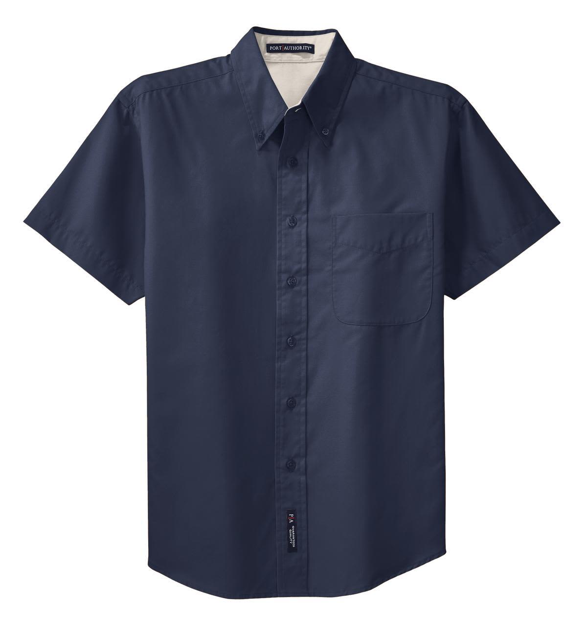 A navy short sleeve button-up shirt featuring a pocket and a logo on the side.