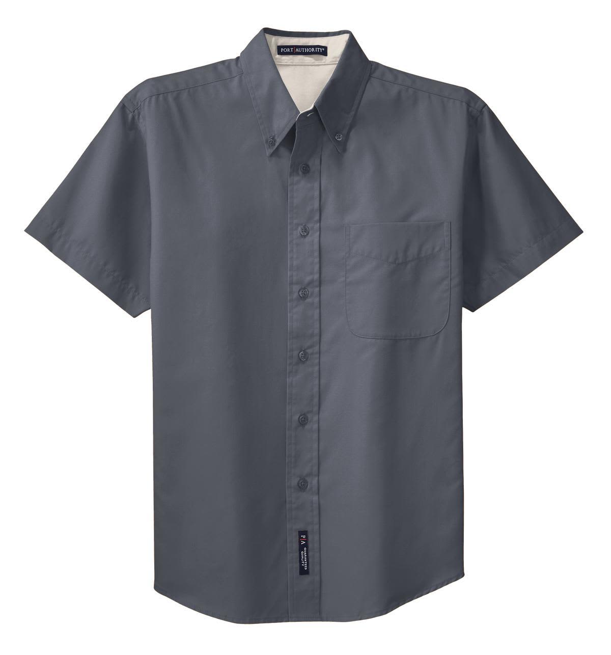 A short sleeve button-up shirt in dark grey, featuring a pocket and a logo.