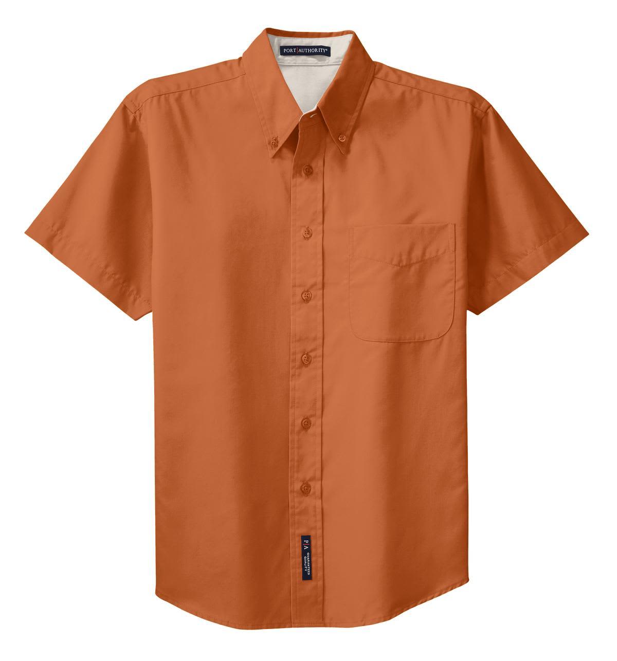 A short sleeve button-up shirt in orange with a front pocket and a logo.