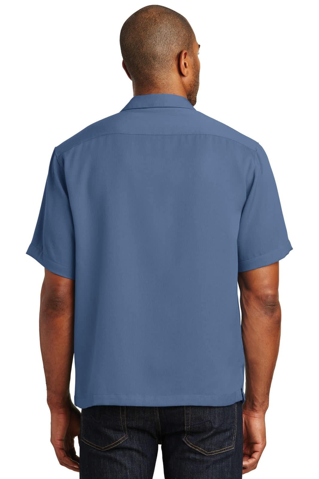 A man wearing a short-sleeved, blue button-up shirt from the back, showcasing a simple design and branding.