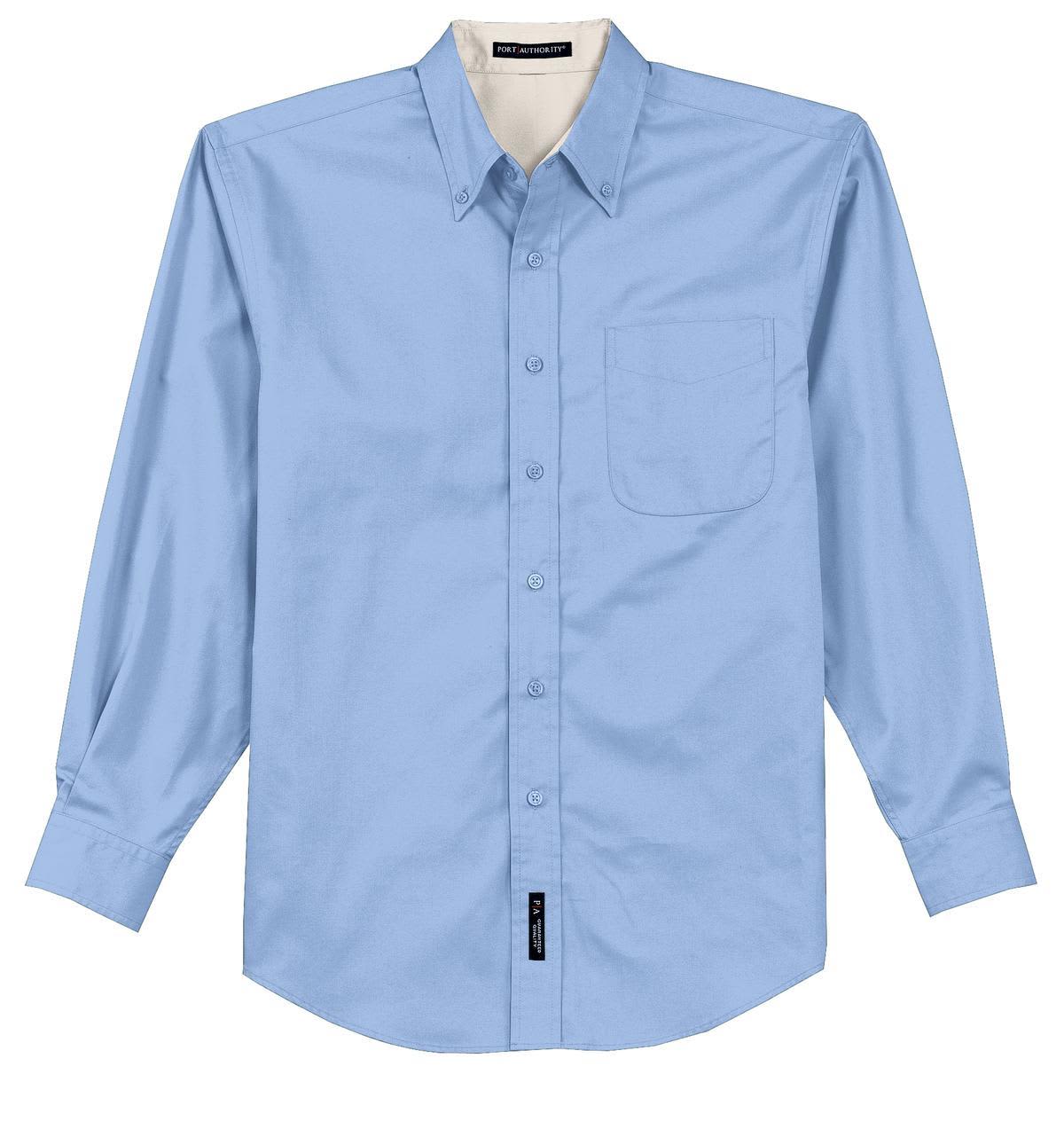 A light blue long sleeve button-up shirt with a chest pocket and a branding tag at the bottom.