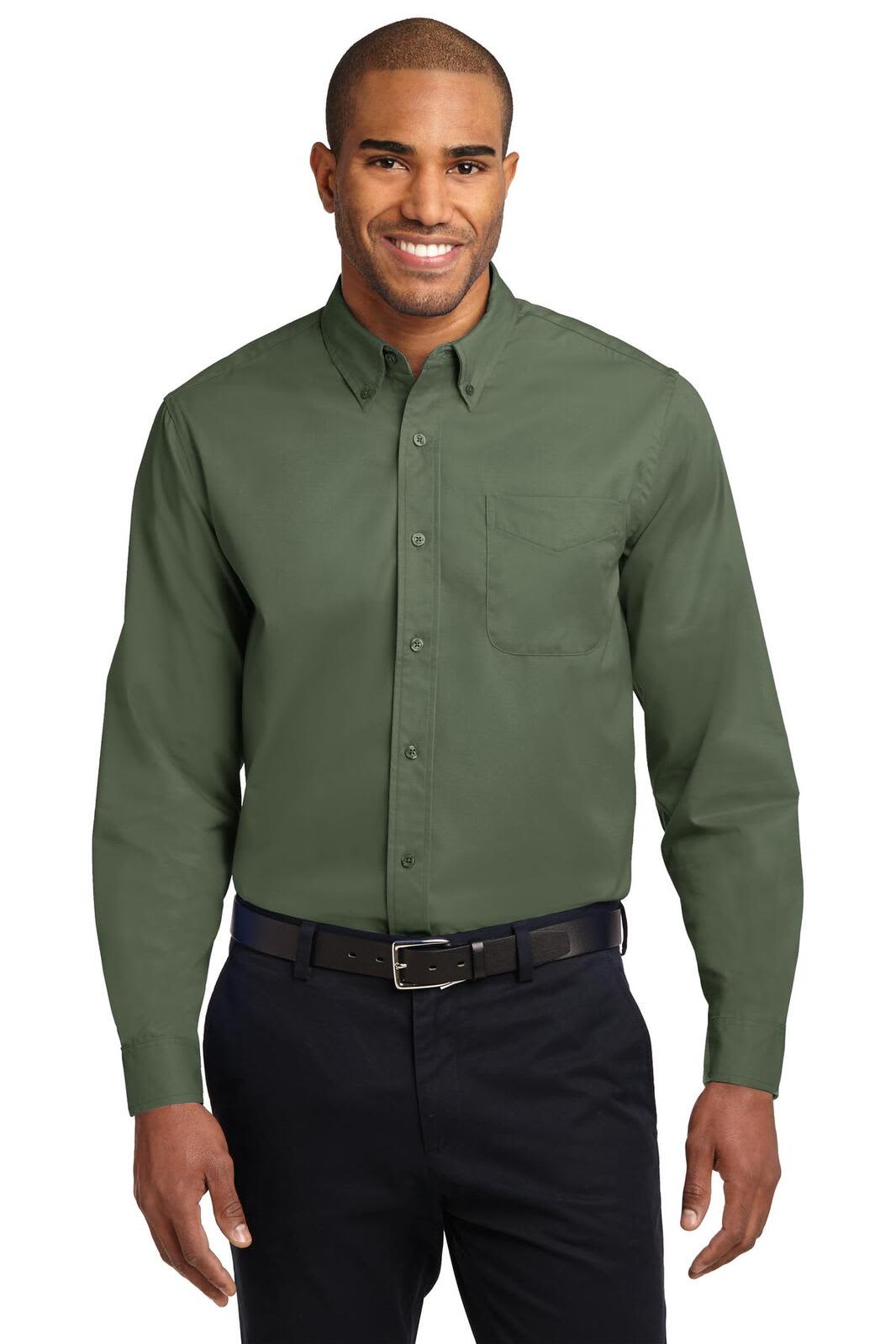 A man wearing a long sleeve, button-up shirt in dark green, featuring a pocket and a collar.