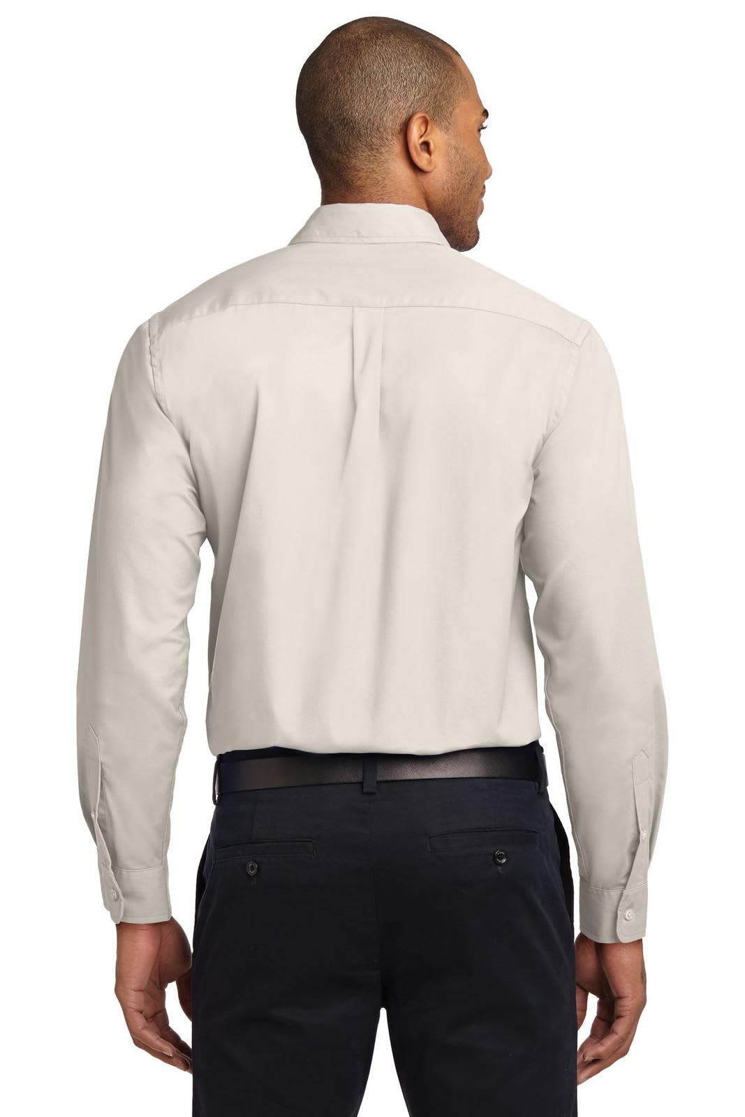 A light-coloured long sleeve button-up shirt with a back yoke and single pleat detail. It has a logo on the collar.