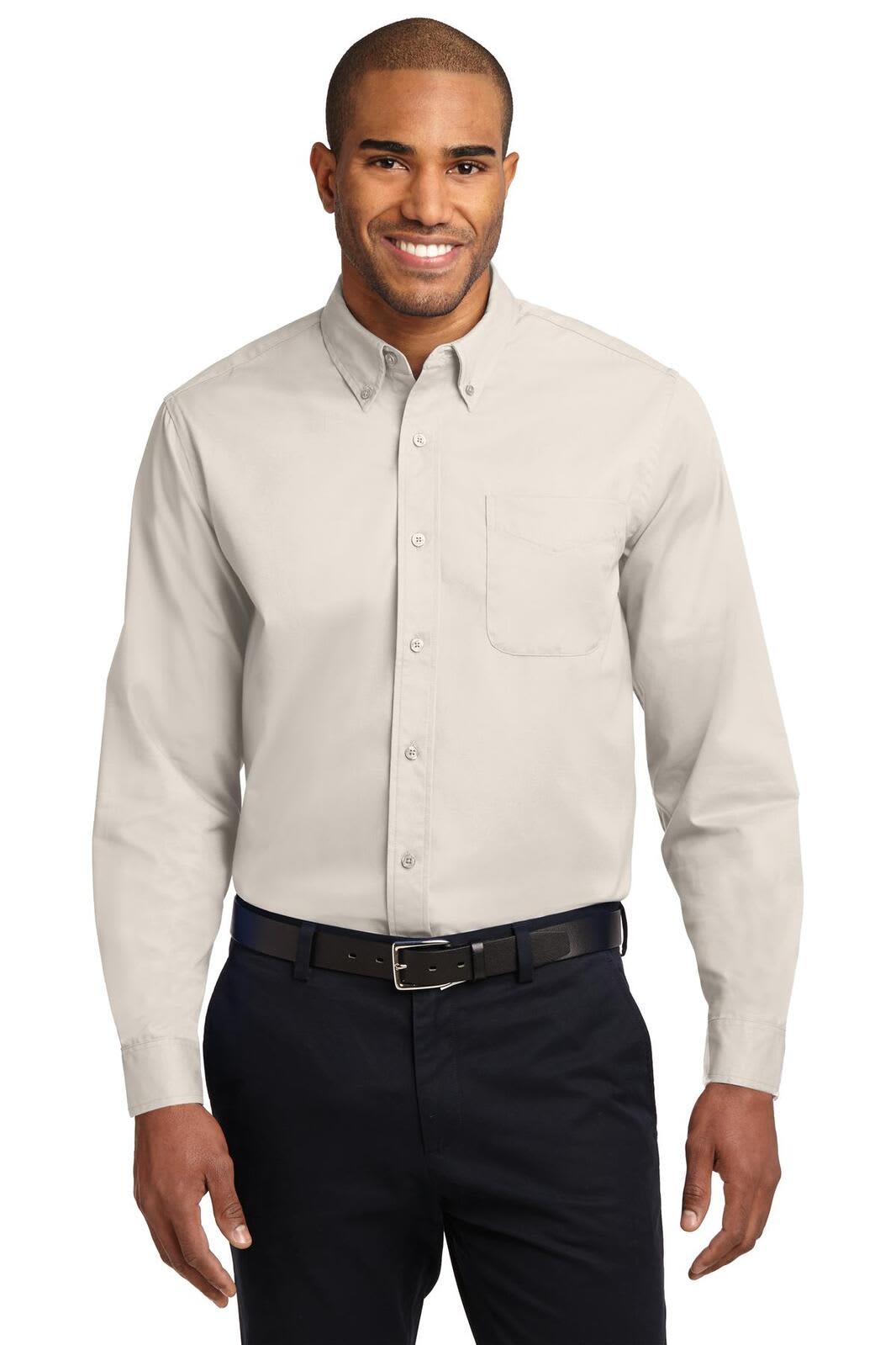 A light grey long sleeve button-up shirt with a pocket, featuring a logo. The model is wearing dark pants and a belt.