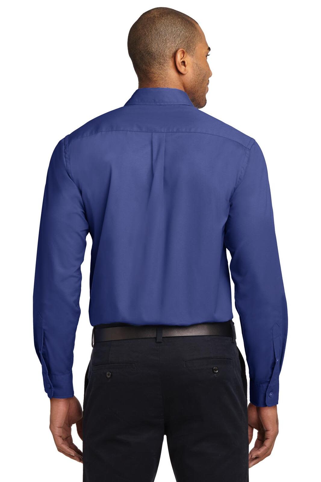 A person wearing a blue long sleeve button-up shirt, featuring a logo, viewed from the back.