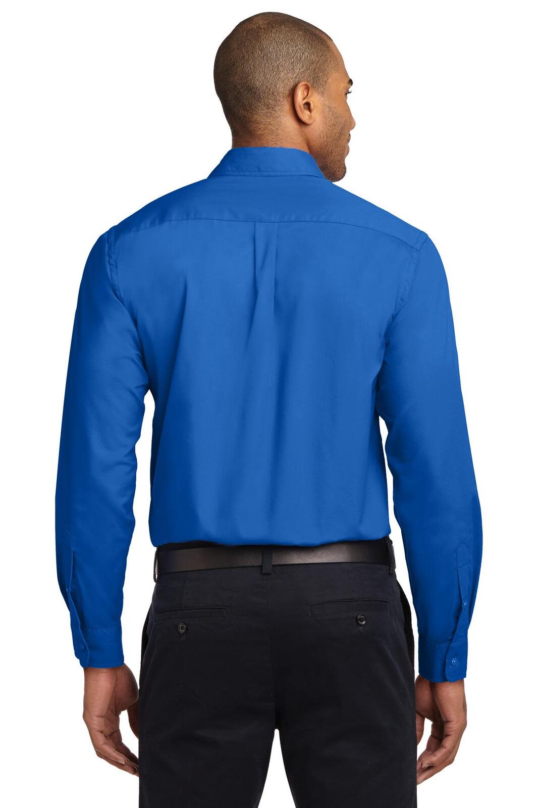 A man wearing a blue long sleeve button-up shirt, viewed from the back, with a logo on the shirt.